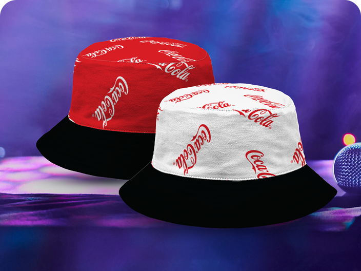 Two reversible Coca-Cola bucket hats, one red and one white, available as a prize in the Festive Moments contest pool.