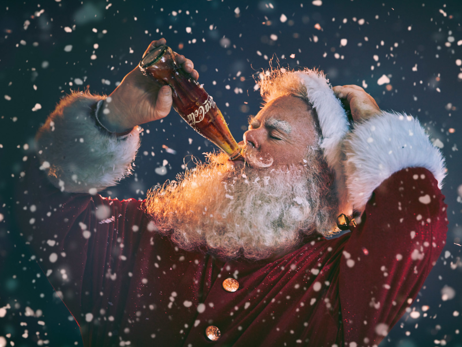 Santa Claus drinks a Coca-Cola