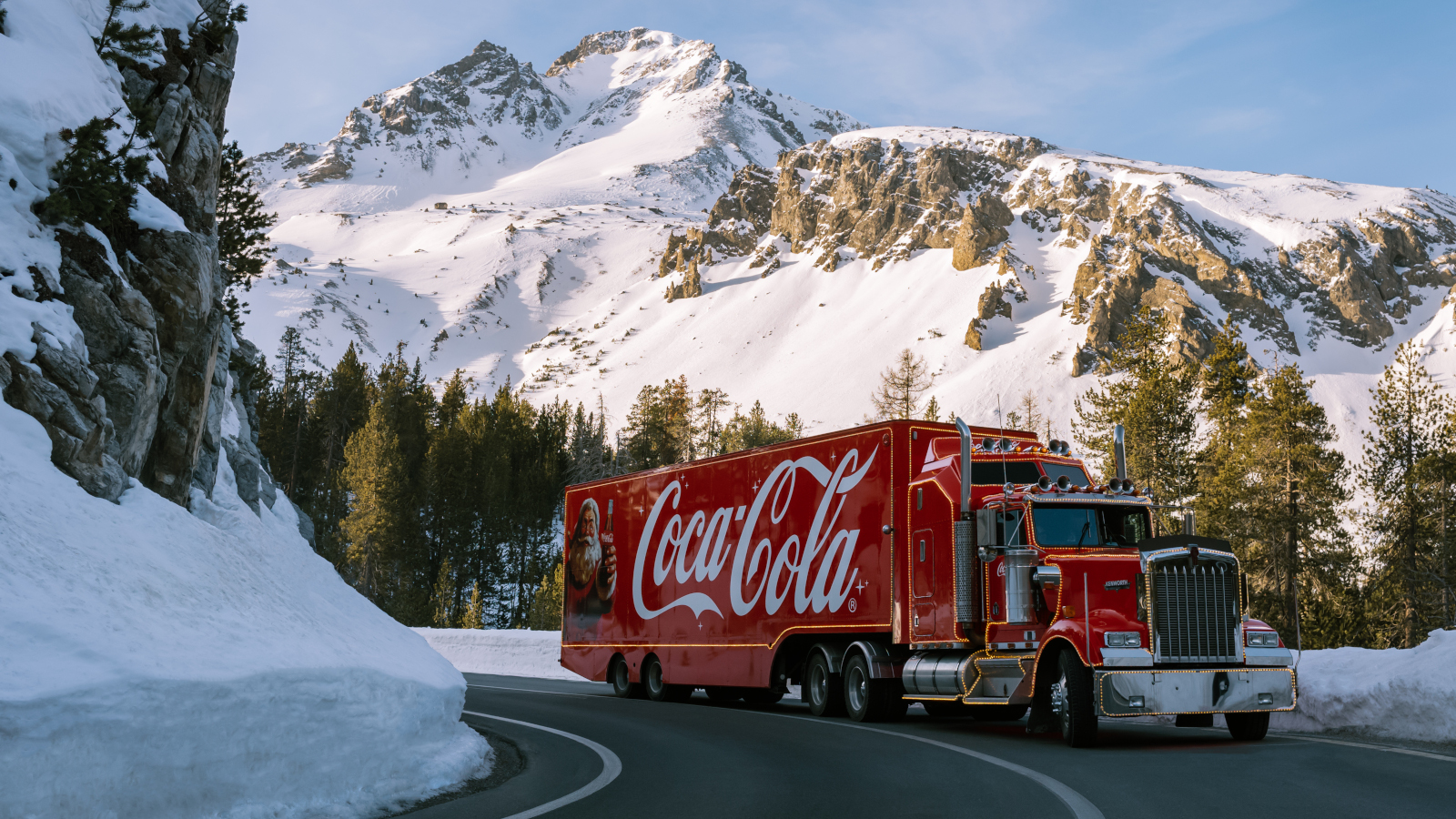 truck on a street between mountains