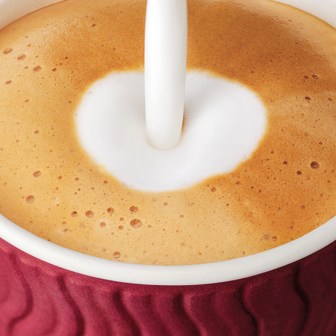 Costa Coffee cup getting filled with milk