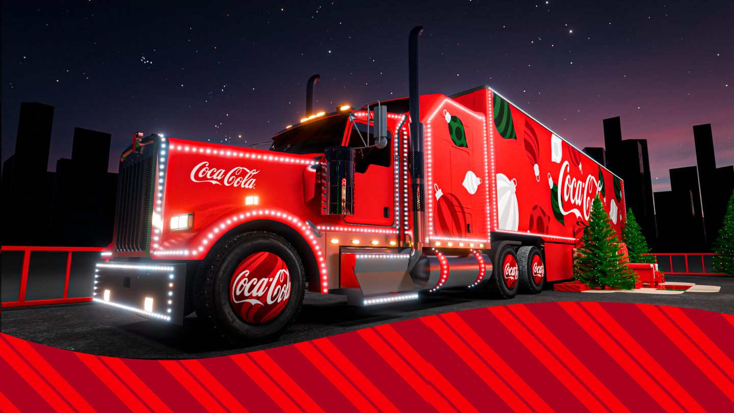 Coca-Cola Weihnachtstruck bei Nacht, beleuchtet mit weißen LED-Lichtern. Der rote Truck ist festlich dekoriert mit Weihnachtskugeln und Coca-Cola Logo.