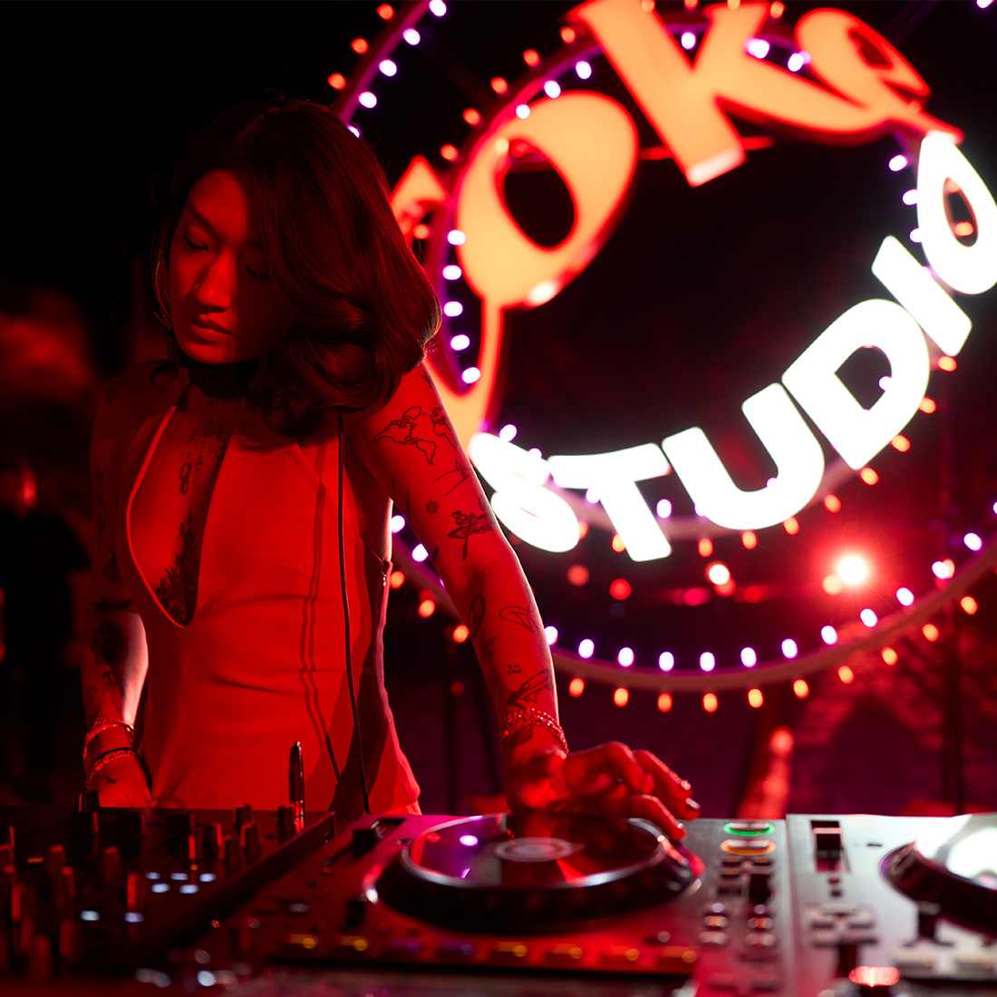 Peggy Gou on stage mixing tracks