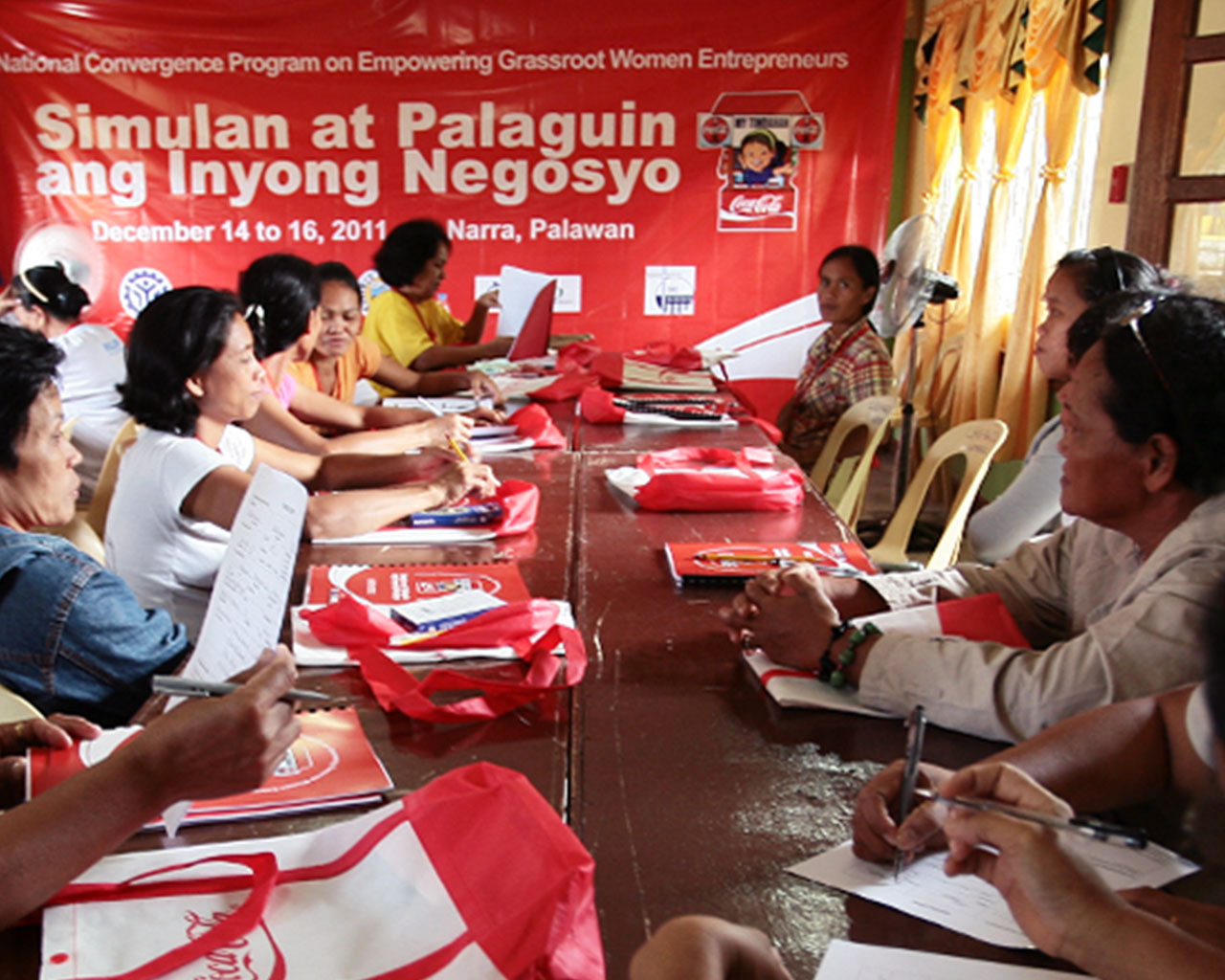 A group of women sitting at a table talking