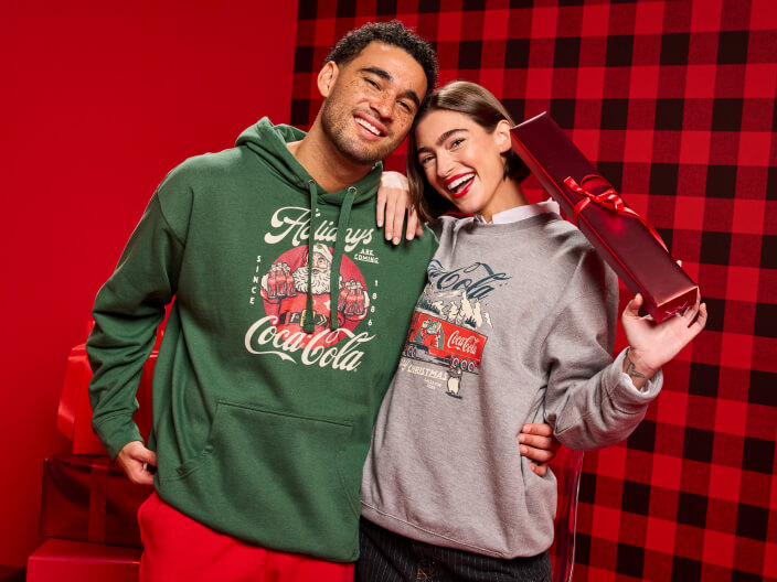 two people in sweats with a giftbox 