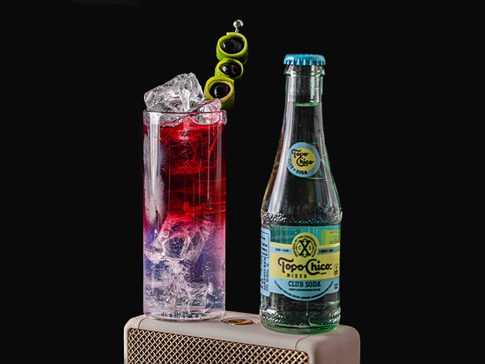 hibiscus shirley temple next to topo chico bottle