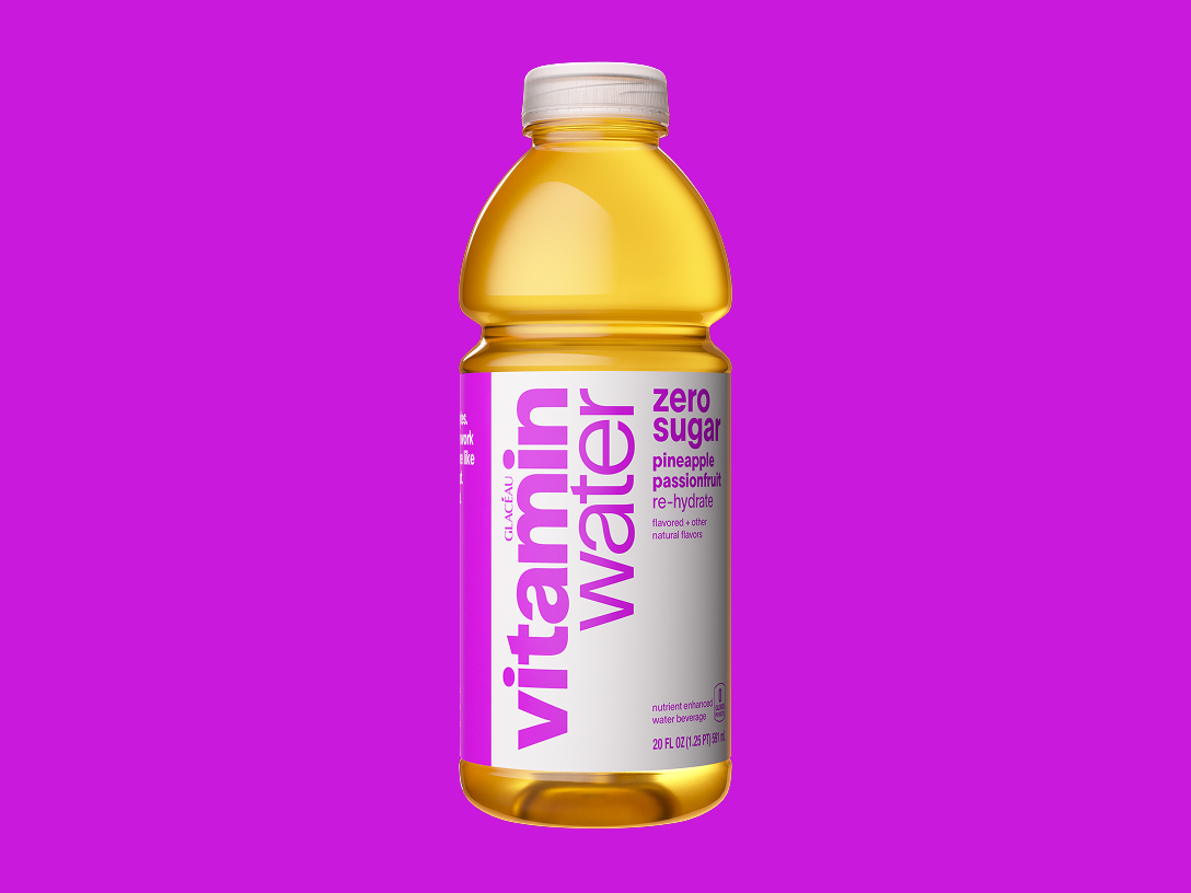 vitaminwater rehydrate zero sugar pineapple passionfruit flavored water beverage on a purple background