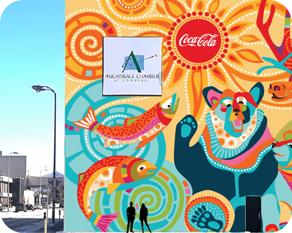 Street view of Dawn Gerety's vibrant Coca‑Cola mural featuring bears and salmon painted on an Anchorage building.