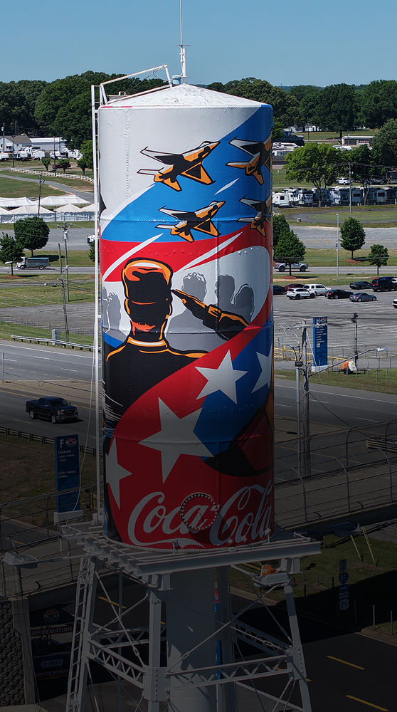 A patriotic Coca-Cola mural honoring the troops on a water tower at the Charlotte Motor Speedway for the Coca-Cola 600 race.