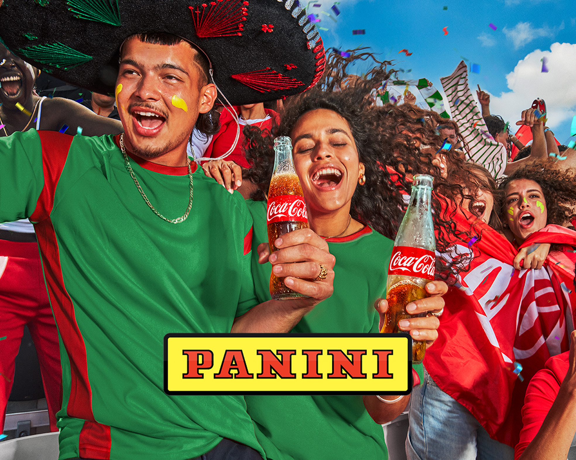 Soccer fans cheering in a stadium, enjoying glass bottles of Coca-Cola with the Panini logo in front of them
