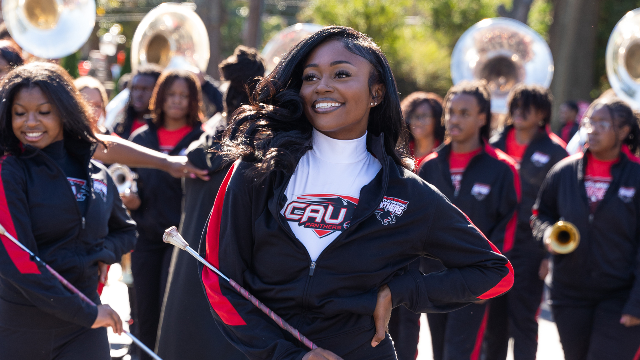 Alt Text An HBCU marching band performing in formation at homecoming