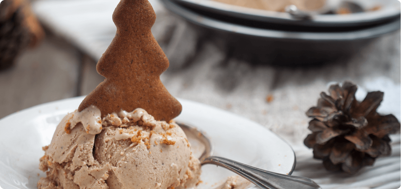 a gingerbread tree in a scoop of ice cream