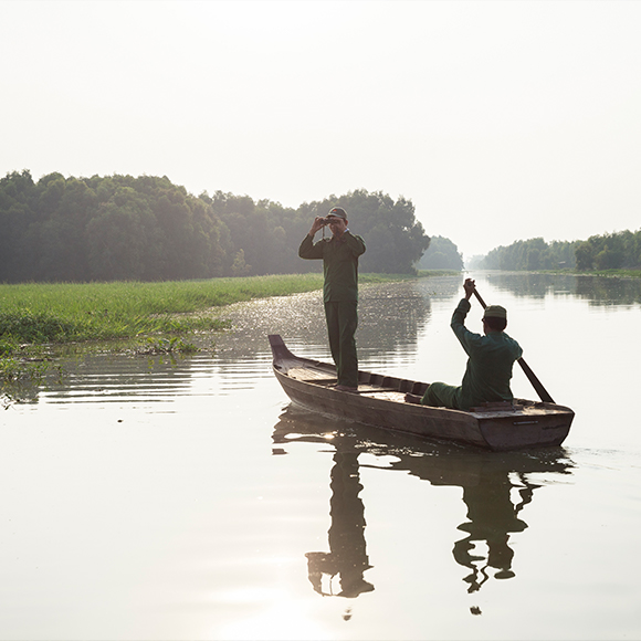 October 15, 2014 - Tram Chim (Vietnam). Park guards during a patrol inside the National Park.